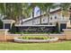 Entrance to community features lush landscaping and prominent signage at 4730 Coral Castle Dr, Kissimmee, FL 34746
