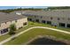 View of the community with green grass, a walking path, and a pond view at 4732 Coral Castle Dr, Kissimmee, FL 34746