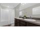 Bathroom with double sinks, vanity, and a shower/tub combination with a white shower curtain at 4732 Coral Castle Dr, Kissimmee, FL 34746