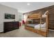 Bedroom with a bunk bed, dark dresser, a TV, and a desk at 4732 Coral Castle Dr, Kissimmee, FL 34746