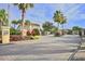 Gated community entrance with lush landscaping and well-maintained grounds at 4732 Coral Castle Dr, Kissimmee, FL 34746