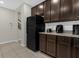 Kitchen features sleek, modern black appliances and ample counter space at 4732 Coral Castle Dr, Kissimmee, FL 34746