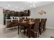 Open-concept kitchen and dining area with seating for eight at 4732 Coral Castle Dr, Kissimmee, FL 34746