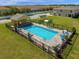 Beautiful fenced-in pool with brick pavers, lounge chairs, and manicured landscaping, perfect for relaxation and recreation at 4732 Coral Castle Dr, Kissimmee, FL 34746