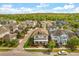Aerial view of the house and neighborhood showing mature trees and landscaping at 8896 Reymont St, Orlando, FL 32827