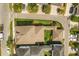Aerial view of a home showcasing lush backyard, mature trees, and neighborhood streets at 8896 Reymont St, Orlando, FL 32827