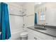 Well-lit bathroom with tiled shower, sleek fixtures, and a bright window at 8896 Reymont St, Orlando, FL 32827