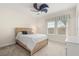 Bedroom with plush carpeting, a ceiling fan, and a cozy bed at 8896 Reymont St, Orlando, FL 32827