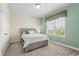 Cozy bedroom featuring carpet, a window, and neutral walls at 8896 Reymont St, Orlando, FL 32827