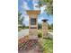 Lake Nona Laureate Park entrance featuring stone pillars and manicured flower beds at 8896 Reymont St, Orlando, FL 32827