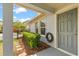 Charming front entrance with gray door, stone path, and landscaped garden at 8896 Reymont St, Orlando, FL 32827