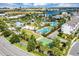 Aerial view of community pool featuring palm trees, a basketball court, and lush landscaping at 8896 Reymont St, Orlando, FL 32827
