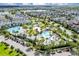 An aerial shot showcasing the community pools and many homes in a vibrant neighborhood at 8896 Reymont St, Orlando, FL 32827