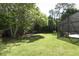 Lush backyard with mature trees, providing ample shade and privacy at 1157 Duncan Dr, Winter Springs, FL 32708
