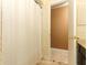 Bright bathroom featuring a neutral-colored shower curtain and tile flooring at 1157 Duncan Dr, Winter Springs, FL 32708