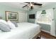Bedroom with a large bed, stylish curtains and fan at 1157 Duncan Dr, Winter Springs, FL 32708