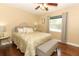 Charming bedroom with a queen bed, a soft headboard and a bench at the foot at 1157 Duncan Dr, Winter Springs, FL 32708