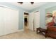 A well-lit bedroom features a double door closet and neutral tile flooring at 1157 Duncan Dr, Winter Springs, FL 32708