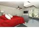 The cozy bedroom boasts plenty of closet space, comfortable seating, and lots of light at 1157 Duncan Dr, Winter Springs, FL 32708