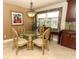 Dining area adjacent to the kitchen with a glass table and decorative chandelier at 1157 Duncan Dr, Winter Springs, FL 32708