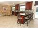 Open kitchen with granite countertops, dark wood cabinetry, and breakfast bar seating at 1157 Duncan Dr, Winter Springs, FL 32708