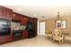 Kitchen with black appliances, granite counters, and adjoining dining area at 1157 Duncan Dr, Winter Springs, FL 32708
