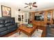 Stylish living room with hardwood floors, and well-lit entertainment center at 1157 Duncan Dr, Winter Springs, FL 32708