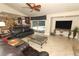 Spacious living room with tile floors, ceiling fan, and sliding glass doors to the pool area at 1157 Duncan Dr, Winter Springs, FL 32708