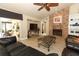 Living room with a brick fireplace and access to the outdoor lanai at 1157 Duncan Dr, Winter Springs, FL 32708