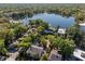 Stunning aerial view of lush, green neighborhood with lake access, highlighting a serene landscape at 128 Waverly Pl # 128, Orlando, FL 32806