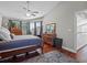 Bedroom featuring hardwood floors, ceiling fan, with good lighting from several windows at 128 Waverly Pl # 128, Orlando, FL 32806