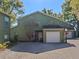 Charming townhome with an attached garage and ample parking on a brick paved drive at 128 Waverly Pl # 128, Orlando, FL 32806