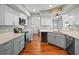 Updated kitchen with stainless steel appliances, stone countertops and hardwood floors at 128 Waverly Pl # 128, Orlando, FL 32806