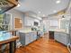 Updated kitchen with stainless steel appliances, stone countertops and hardwood floors at 128 Waverly Pl # 128, Orlando, FL 32806