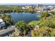Breathtaking aerial lake view, showcasing nearby buildings and a peaceful waterside atmosphere at 128 Waverly Pl # 128, Orlando, FL 32806