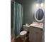 Bathroom featuring a shower/tub, vanity and mirror at 13018 S Sunset Ter, Winter Garden, FL 34787