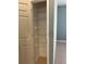 Linen closet with metal shelving at 13018 S Sunset Ter, Winter Garden, FL 34787
