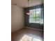 Dining room featuring a window, chandelier and lots of natural light at 13018 S Sunset Ter, Winter Garden, FL 34787