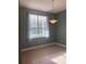 Bright dining room featuring a window, chandelier and lots of natural light at 13018 S Sunset Ter, Winter Garden, FL 34787