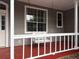 Close up of a charming porch with a swing seat for relaxing at 13018 S Sunset Ter, Winter Garden, FL 34787