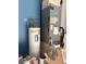Home utility space with a water heater, Daikin air conditioning unit, and various equipment for home maintenance at 13018 S Sunset Ter, Winter Garden, FL 34787