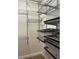 Walk-in closet equipped with metal shelving and storage baskets at 13018 S Sunset Ter, Winter Garden, FL 34787