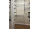 Walk-in closet equipped with metal shelving and hanging rods at 13018 S Sunset Ter, Winter Garden, FL 34787