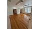 Bright bedroom with hardwood flooring, natural light, and closet access at 138 W Stetson Ave, Deland, FL 32720