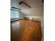 Spacious bedroom features hardwood floors, window, and built in shelving at 138 W Stetson Ave, Deland, FL 32720