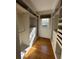 Walk-in closet with custom shelving and hardwood floors at 138 W Stetson Ave, Deland, FL 32720