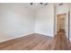 Clean bedroom featuring wood-look floors, white walls, and a bright window at 1457 Resolute St, Celebration, FL 34747