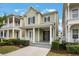 Charming two-story home featuring a welcoming front porch with classic white columns and well-maintained landscaping at 1457 Resolute St, Celebration, FL 34747
