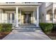 Inviting front porch with classic columns and a welcoming entrance at 1457 Resolute St, Celebration, FL 34747
