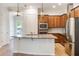 Modern kitchen featuring stainless steel appliances and granite countertops at 1457 Resolute St, Celebration, FL 34747